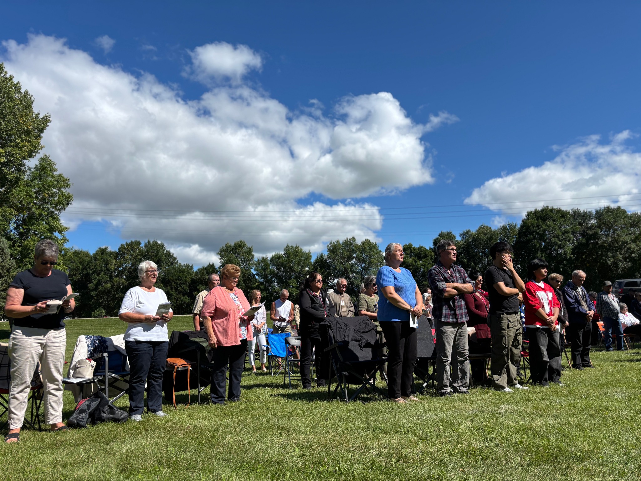 Bethel Baptist Church congregation gathered together in worship outdoors